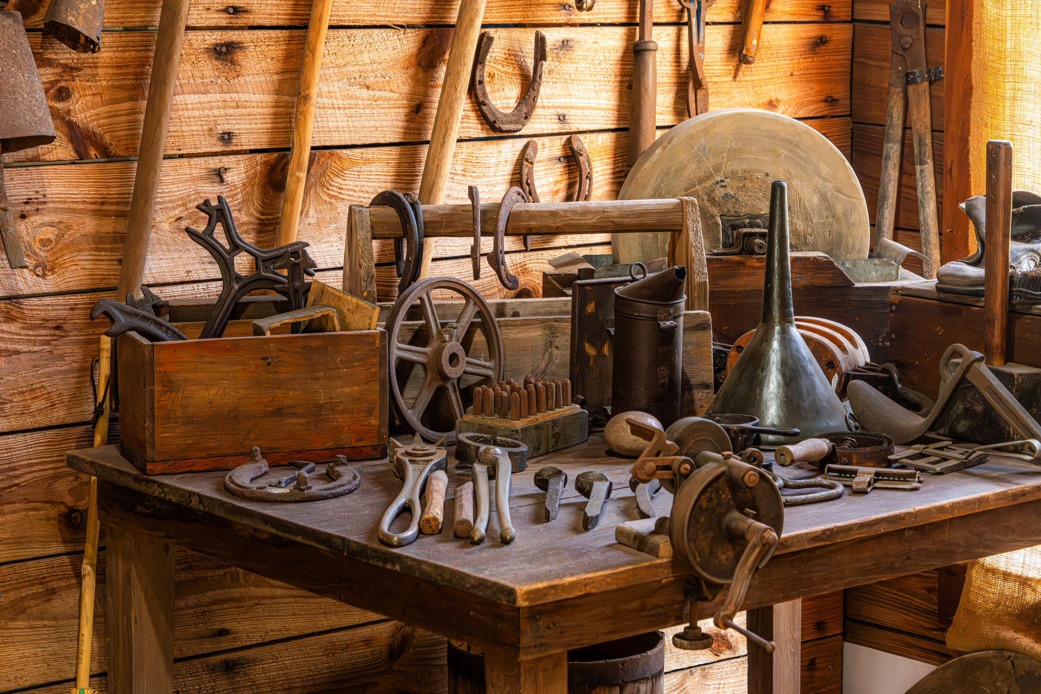 Old Tools on a Wooden Table in a Workshop